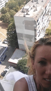 Girl poping on the balcony