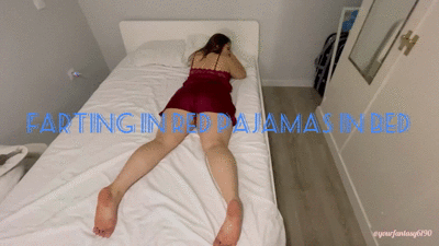 Farting in red pajamas in bed