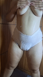 Sexy girl poops in a diaper