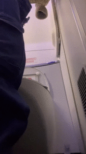 Peeing in an airplane bathroom